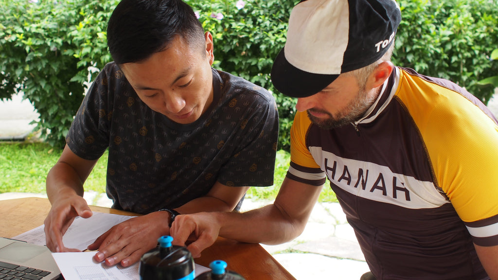 HANAH Founder Joel Einhorn looks over maps with the locals to get an understanding of the course.